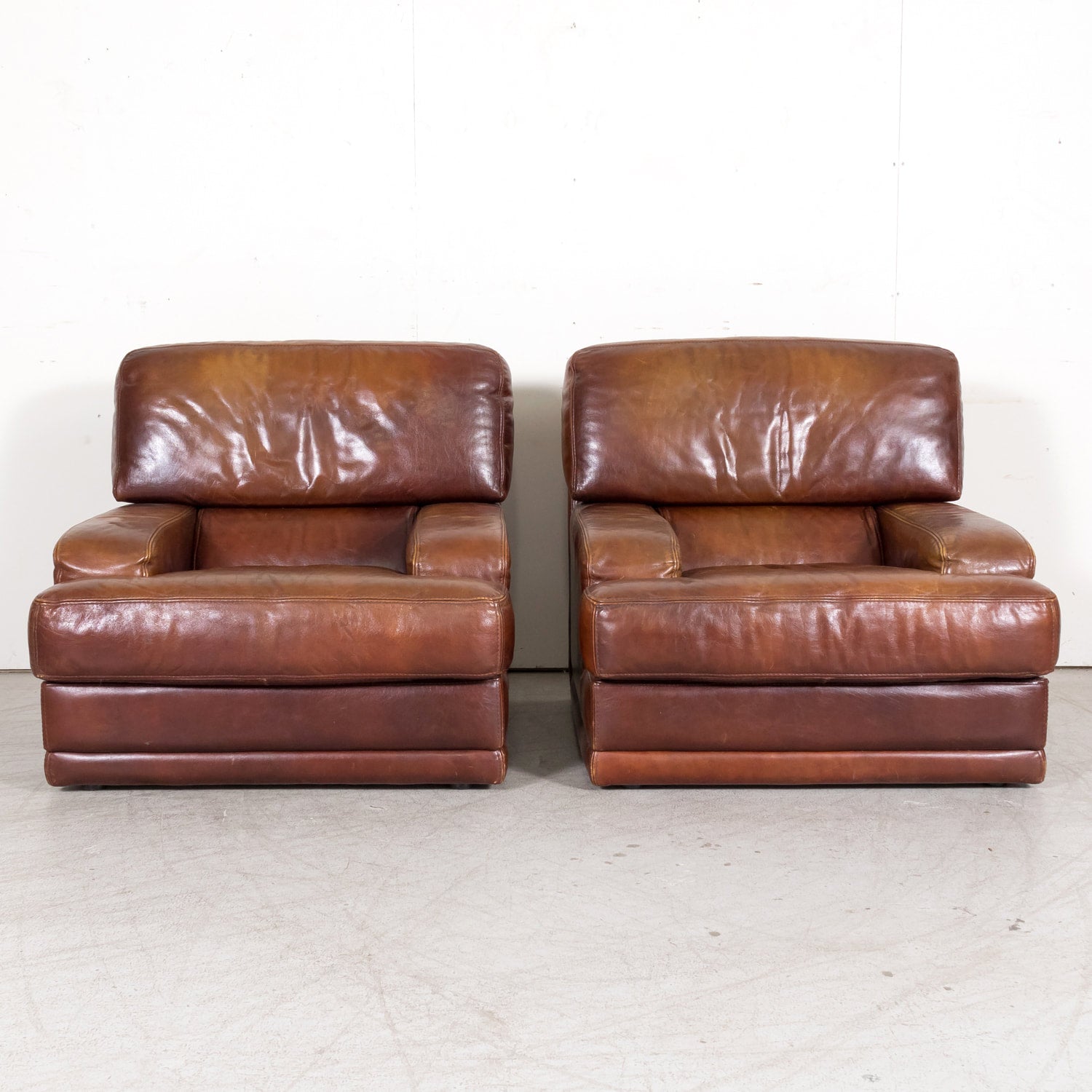 1970s Pair of French Mid-Century Modern Oversized Cognac Leather Armchairs or Lounge Chairs