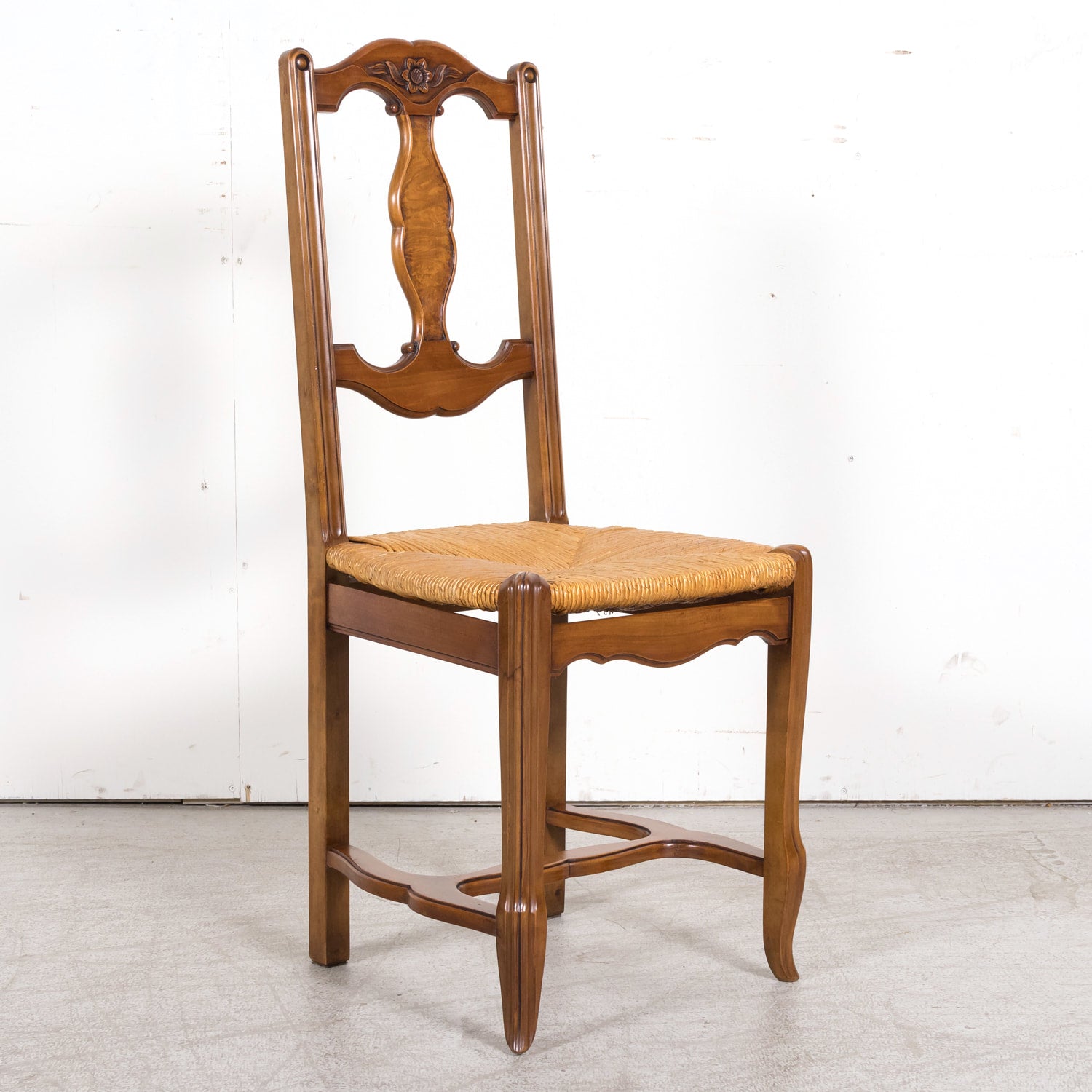 Set of Eight 19th Century Country French Louis XV Style Carved Walnut Dining Side Chairs with Rush Seats