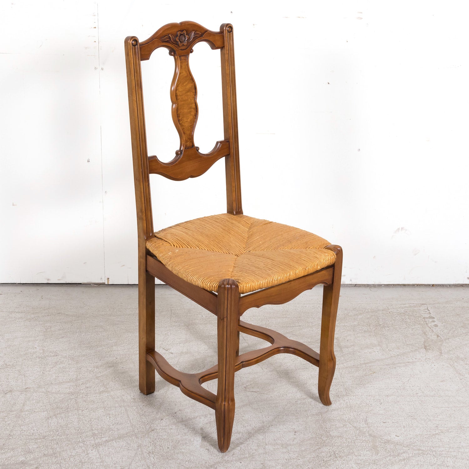 Set of Eight 19th Century Country French Louis XV Style Carved Walnut Dining Side Chairs with Rush Seats