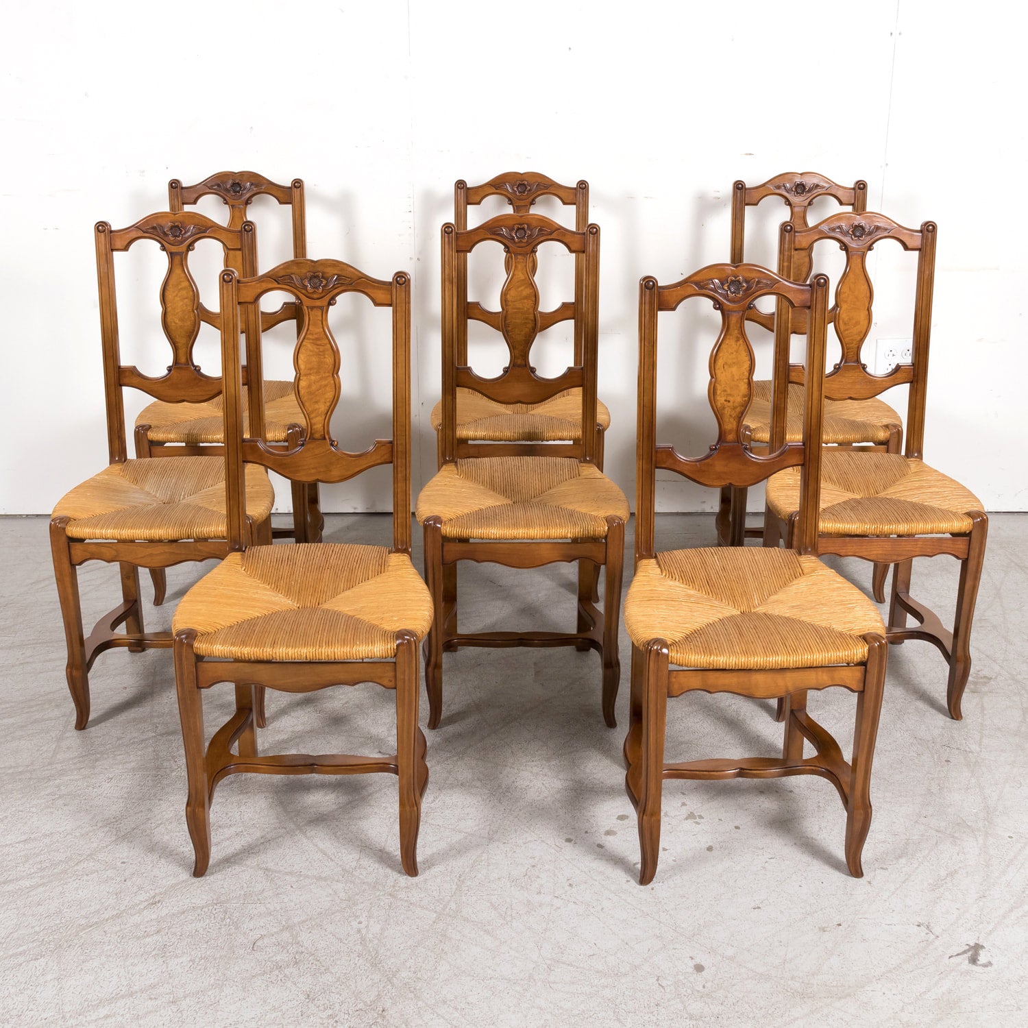 Set of Eight 19th Century Country French Louis XV Style Carved Walnut Dining Side Chairs with Rush Seats