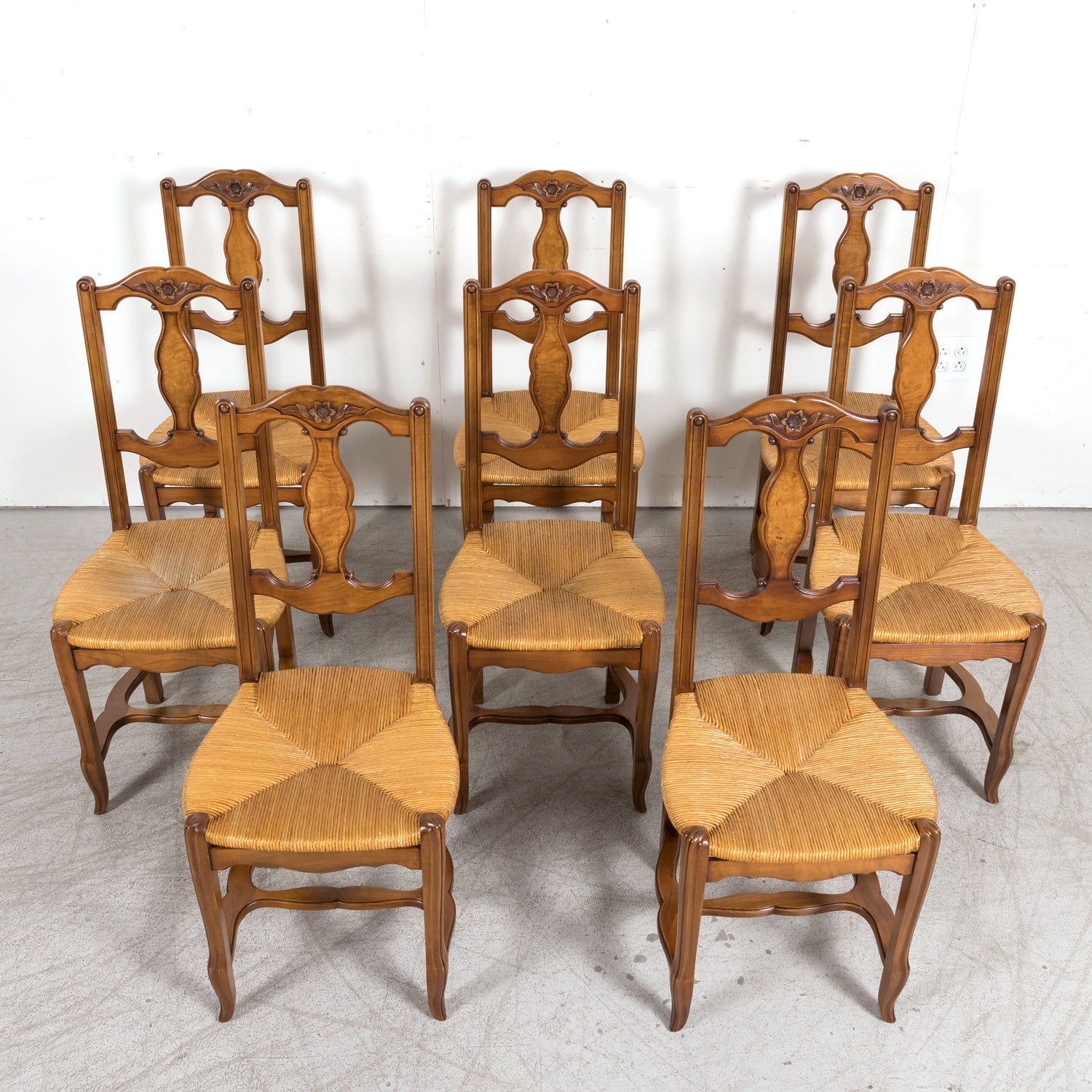 Set of Eight 19th Century Country French Louis XV Style Carved Walnut Dining Side Chairs with Rush Seats