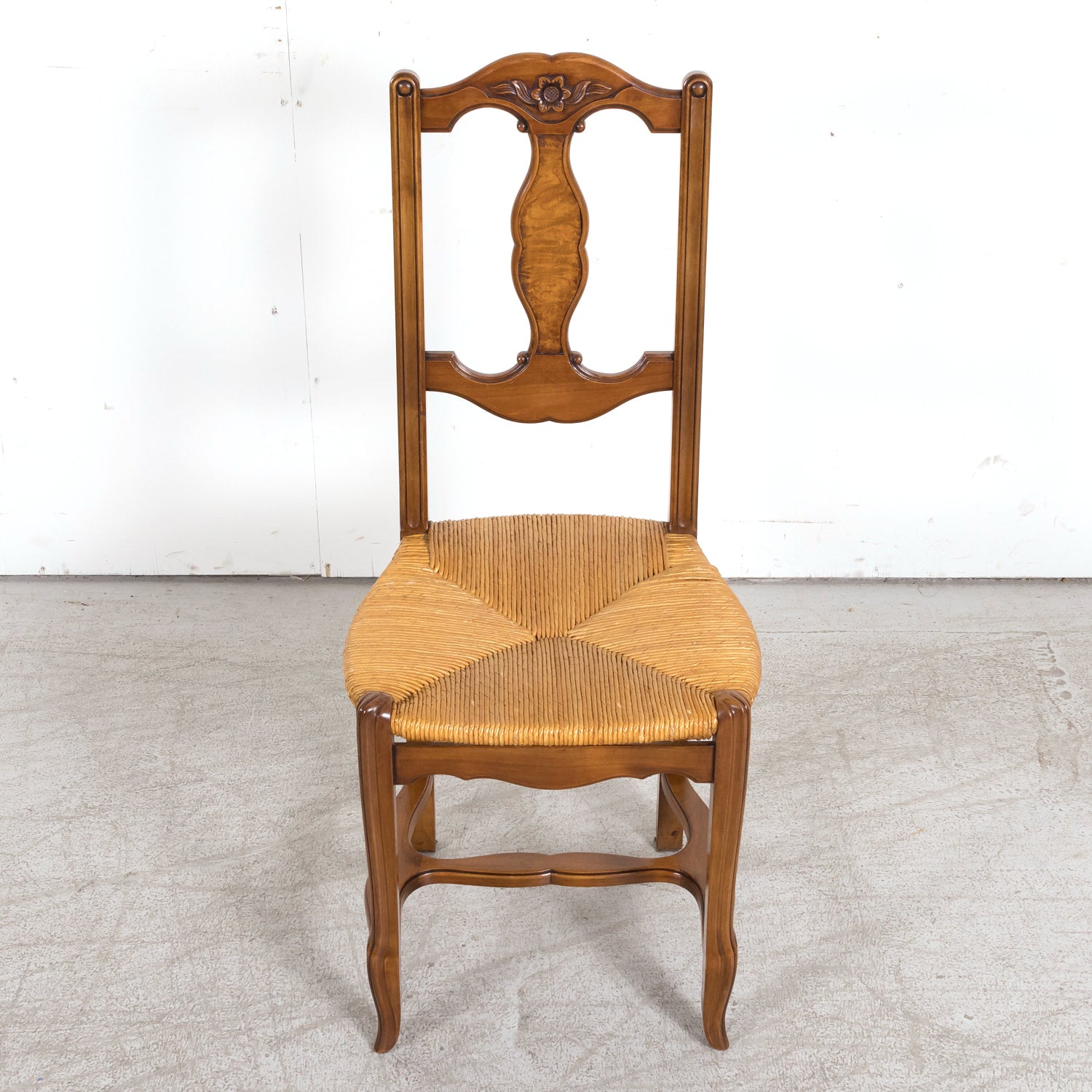 Set of Eight 19th Century Country French Louis XV Style Carved Walnut Dining Side Chairs with Rush Seats
